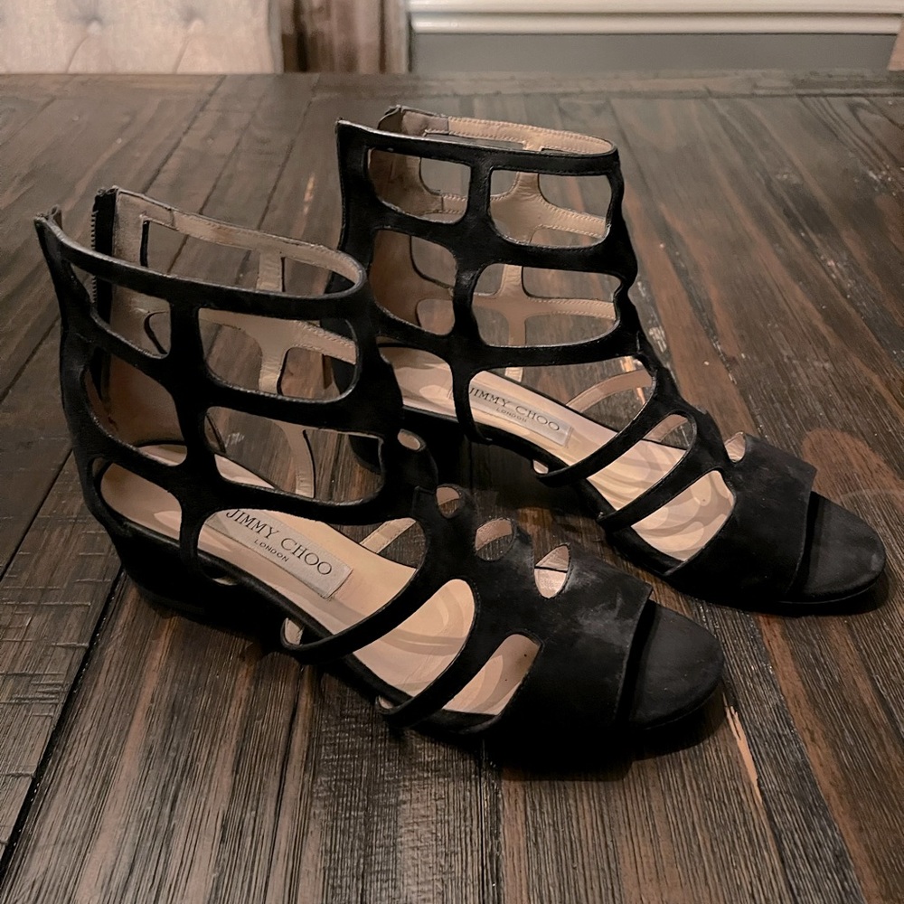 Jimmy Choo black heel sandals.